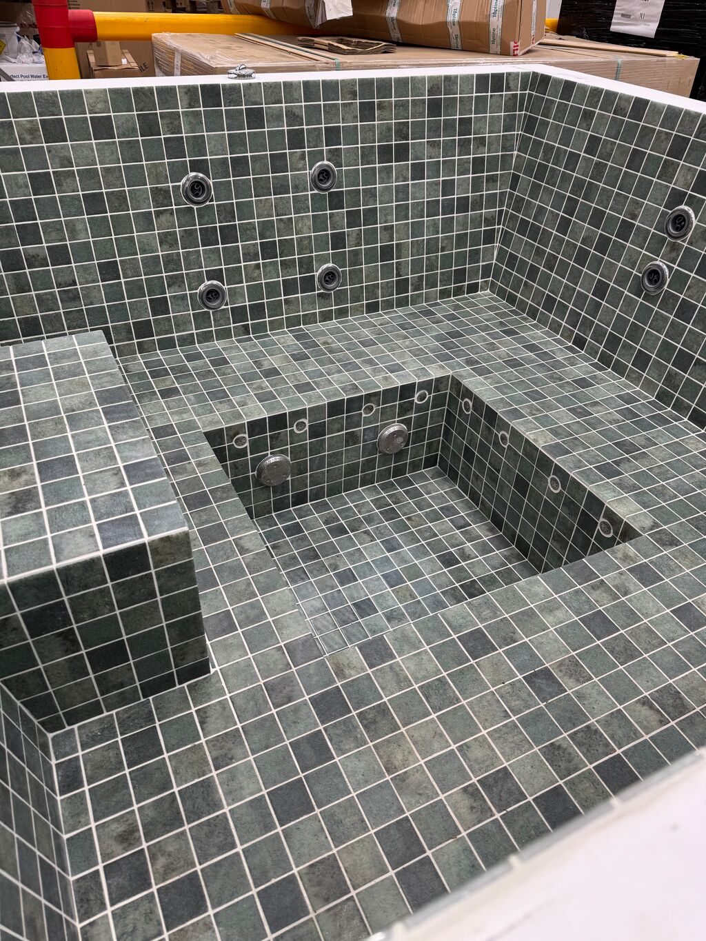 2m Square Tiled Skimmer Spa - corner view of tiled water jets and central step