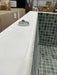 2m Square Tiled Skimmer Spa - untiled top edge, flange and piezo button detail